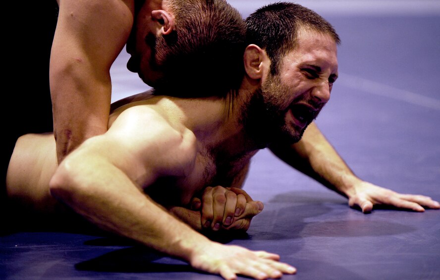 MOUNTAIN HOME AIR FORCE, Idaho -- Airman 1st Class Robbie Hedrick from Hill Air Force Base, Utah, wrestles Airman 1st Class Christopher Bloom, also from Hill AFB, Feb. 25. Wrestlers from across the Air Force began participating in the wrestling camp at Mountain Home Air Force Base, Idaho, this week. The Airmen will continue to train until the "wrestle-off" March 7 and 8 when they try out for the Air Force team. (U.S. Air Force photo/ Senior Airman Stephany Miller)