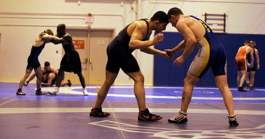 MOUNTAIN HOME AIR FORCE, Idaho -- Airmen participating in the Air Force Wrestling Camp practice their moves against each other Feb. 25. Wrestlers from across the Air Force are participating in the wrestling camp at Mountain Home Air Force Base, Idaho, this week. The Airmen will continue to train until the "wrestle-off" March 7 and 8 when they try out for the Air Force team. (U.S. Air Force photo/ Senior Airman Stephany Miller)