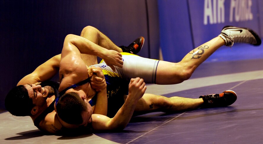 MOUNTAIN HOME AIR FORCE, Idaho -- Jeff Zastro from the Air Force Academy, Colo., wrestles Airman 1st Class Nader Maghribi from Travis Air Force Base, Calif., Fed. 25. Wrestlers from all around the Air Force are participating in the Air Force Wrestling Camp at Mountain Home AFB, Idaho, this week. The Airmen will continue to train until the "wrestle-off" March 7 and 8 when they try out for the Air Force team. (U.S. Air Force photo/ Senior Airman Stephany Miller)
