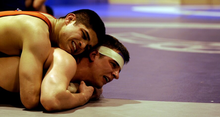 MOUNTAIN HOME AIR FORCE, Idaho -- Airman Matthew Adams from Spangdahlem Air Base, Germany, wrestles Senior Airman Dean Maraj from Royal Air Force Croughton, United Kingdom, Feb. 25. Wrestlers from all around the Air Force are participating in the Air Force Wrestling Camp at Mountain Home AFB, Idaho, this week. The Airmen will continue to train until the "wrestle-off" March 7 and 8 when they try out for the Air Force team. (U.S. Air Force photo/ Senior Airman Stephany Miller)