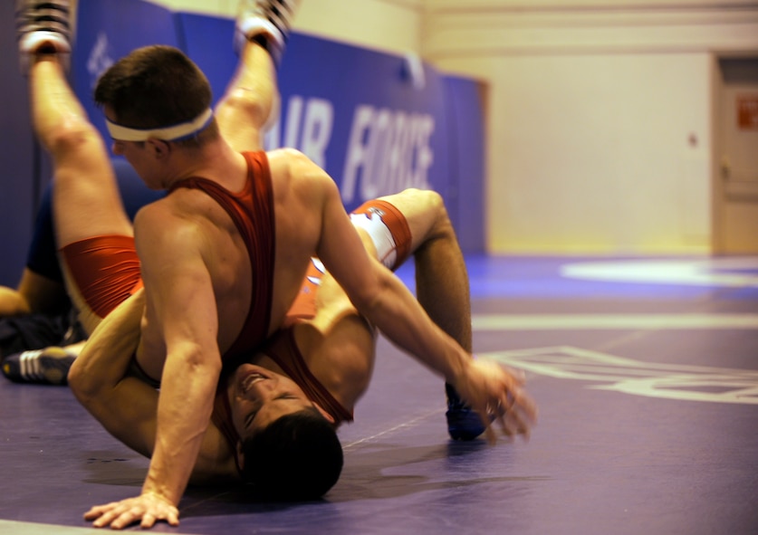 MOUNTAIN HOME AIR FORCE, Idaho -- Airman Matthew Adams from Spangdahlem Air Base, Germany, wrestles Senior Airman Dean Maraj from Royal Air Force Croughton, United Kingdom, Feb. 25. Wrestlers from all around the Air Force are participating in the Air Force Wrestling Camp at Mountain Home Air Force Base, Idaho, and began arriving Feb. 13. The Airmen will continue to train until the "wrestle-off" March 7 and 8 when they try out for the Air Force team. (U.S. Air Force photo/ Senior Airman Stephany Miller)