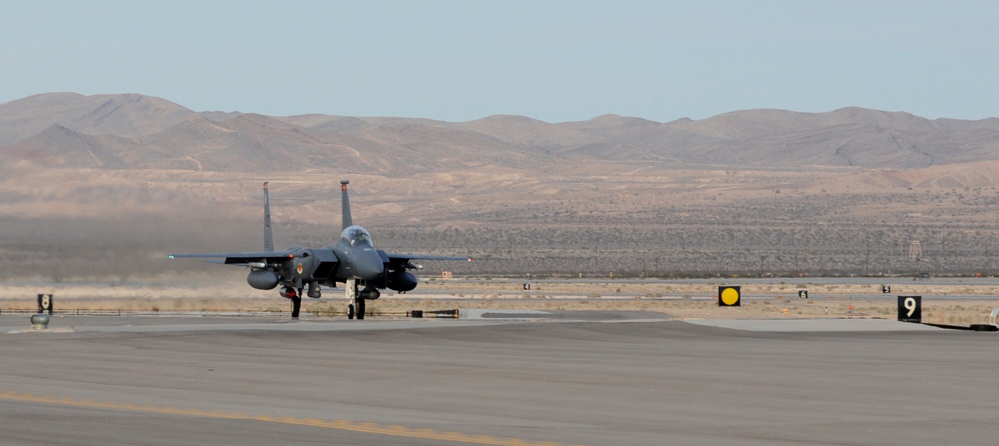 NELLIS AIR FORCE BASE, Nev. -- An F-15E Strike Eagle from Mountain Home Air Force Base lands at Nellis Air Force Base, Nev., Feb. 20 to participate in Red Flag 09-3. Red Flag, the Air Force’s largest air-to-air combat training exercise, includes more than 90 aircraft, 2,000 personnel and 27 units. This Red Flag is the first time since 1981 that the exercise will run for three straight weeks. (U.S. Air Force photo by Airman 1st Class Debbie Lockhart)