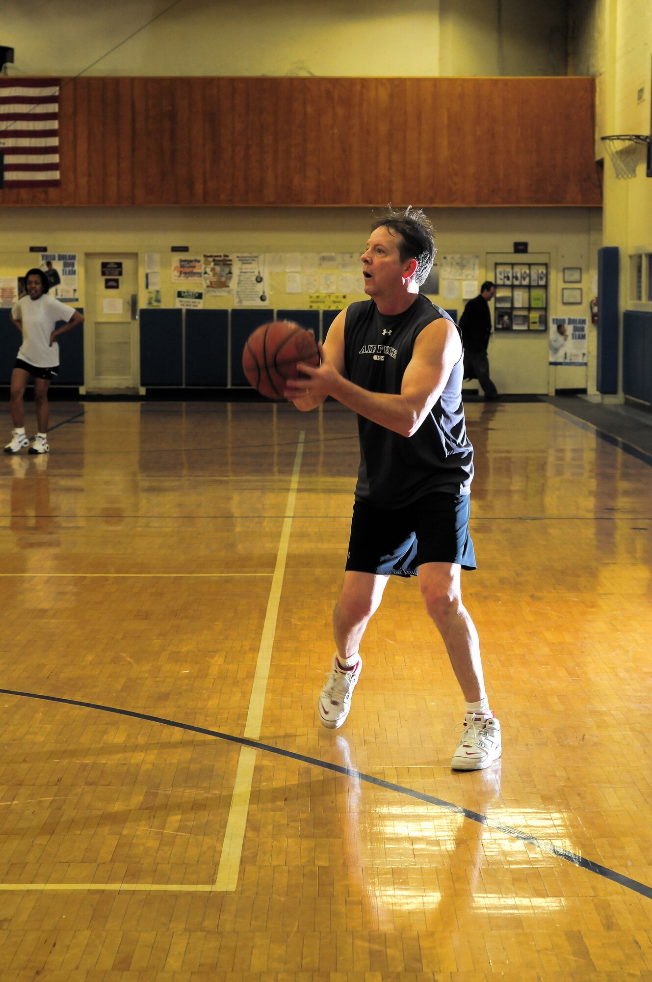 Chief Master Sgt. of the Air Force Rodney J. McKinley prepares to make a shot during a basketball game Feb. 25 at Maxwell Air Force Base's Gunter Annex in Alabama. Chief McKinley and other chief master sergeants played against instructors at the Senior NCO Academy in the early-morning game. (U.S. Air Force photo/Master Sgt. Scott Moorman) 
