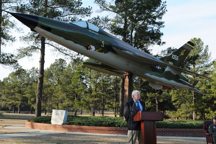 Retired Lieutenant Col.  Micheal Cooper, United States Air Force, speaks highly of Col. James Hiteshaw at an F-105 Thunderchief dedication ceremony on Seymour Johnson Air Force Base, N.C., Feb. 13, 2009. The F-105 Thunderchief static display was dedicated in honor of Col. James Hiteshaw, 4th Fighter Wing aviator and prisoner of war during Vietnam. (U.S. photo by Airman 1st Class Whitney Lambert)