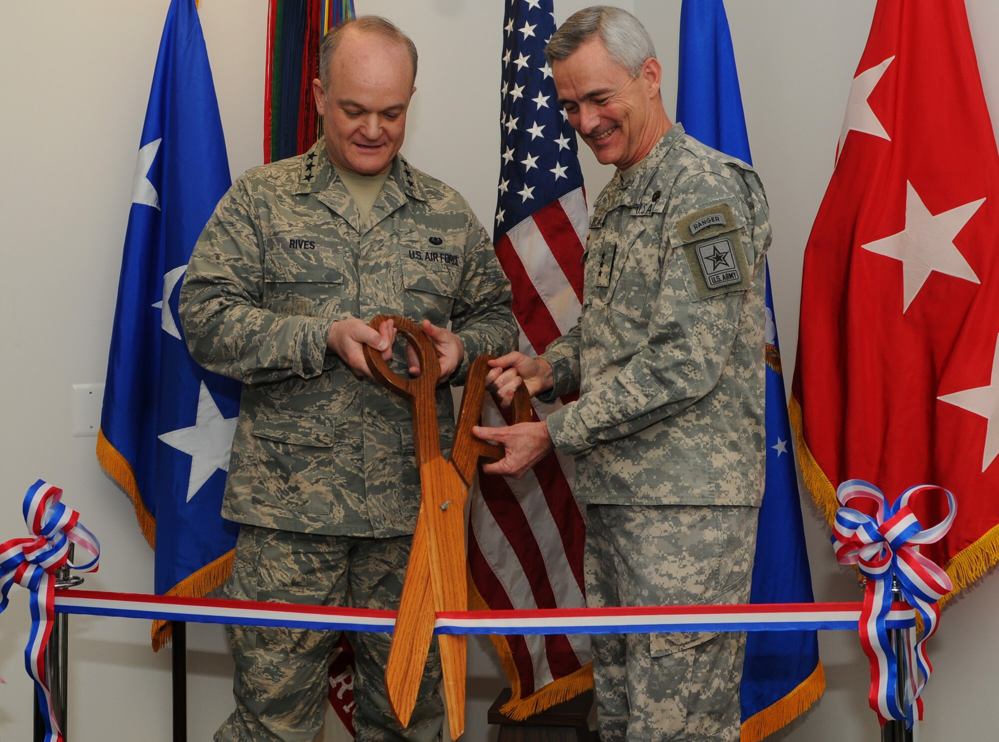 Lt. Gen. Jack L. Rives and Lt. Gen. Scott C. Black perform the ribbon cutting at the Pentagon Army Air Force Legal Assistance Office Feb. 25. The PAAFLAO offers legal assistance to active duty Army and Air Force personnel and their families, retirees and their families and certain National Guard and Reserve servicemembers. For more information or to schedule an appointment, call (703) 571-3114. Directions to the office from the Pentagon Metro Station are available upon request. (U.S. Air Force photo by Thomas Dennis)