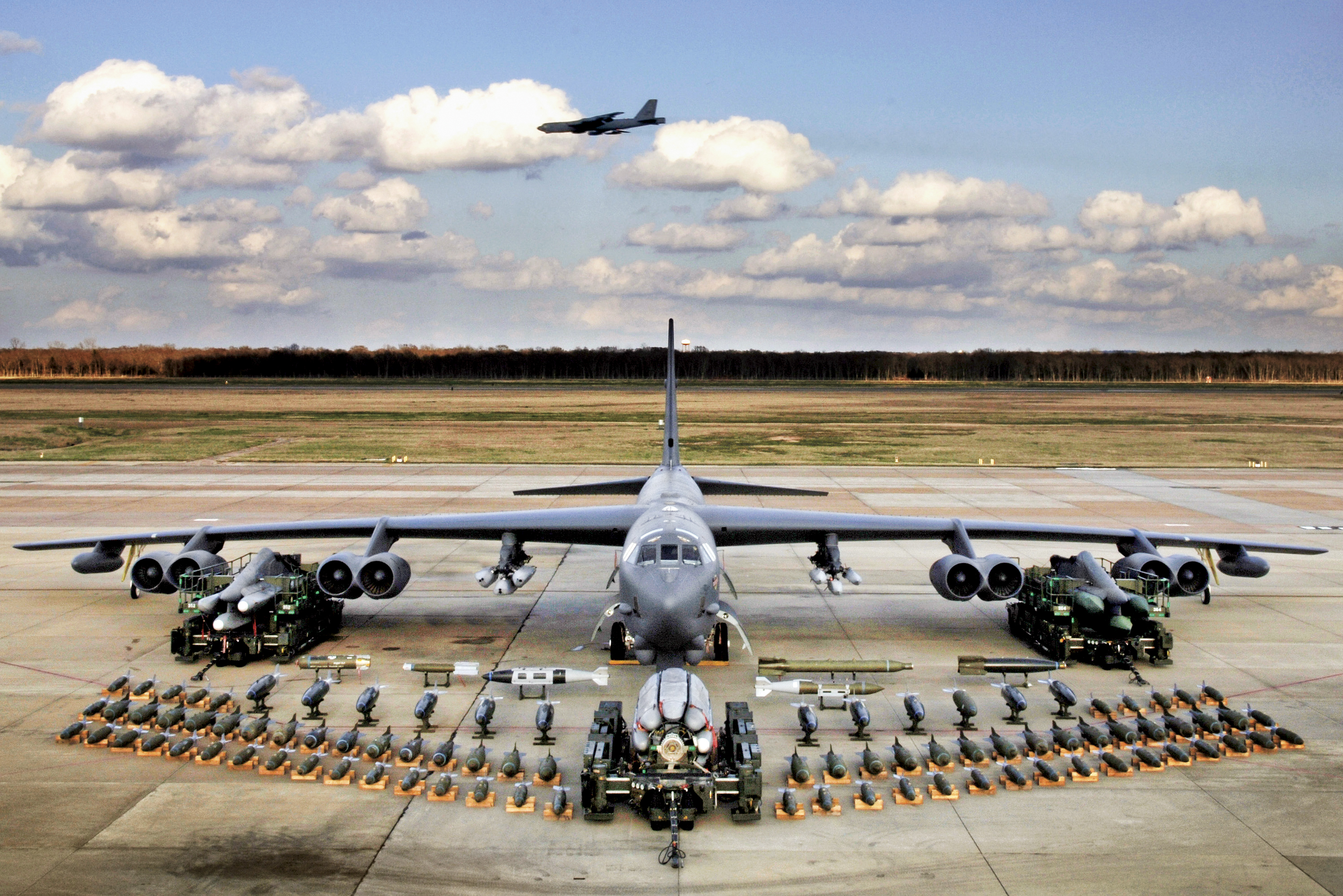 A B-52 bomber with different bombs