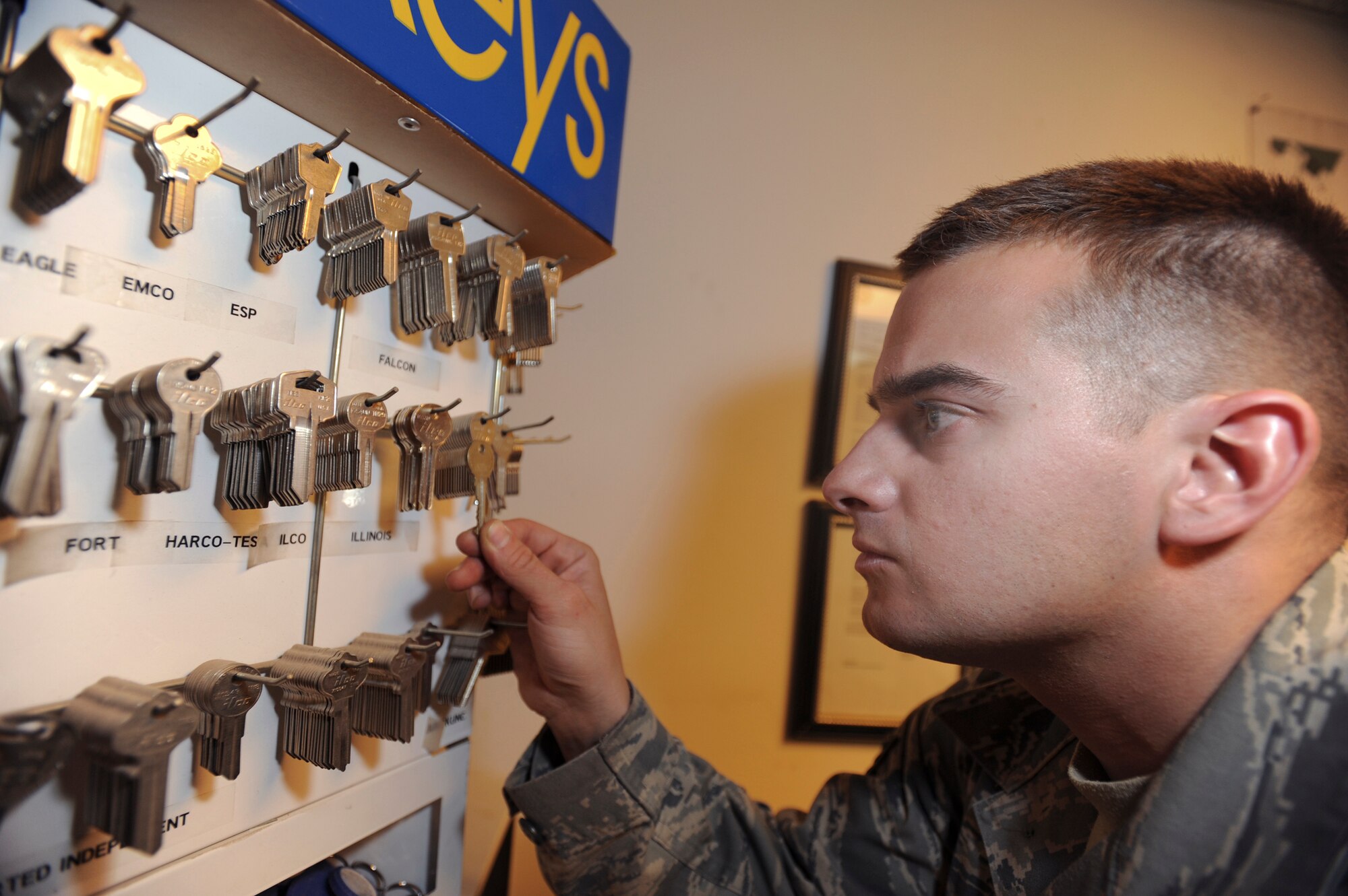 Senior Airman Jesse Testudine, a locksmith with the 379th Expeditionary Civil Engineer Squadron, searches for the correct key blank to make a duplicate key, Feb. 25, 2009, in an undisclosed location in Southwest Asia.  Airman Testudine and fellow locksmith's make around 430 keys a month for new personnel, new building structures, and to replace lost keys.  Airman Testudine is native to Baltimore, M.D. and is deployed from Misawa Air Base, Japan in support of Operations Iraqi and Enduring Freedom and Combined Joint Task Force - Horn of Africa.  (U.S. Air Force Photo by Staff Sgt. Joshua Garcia/released)