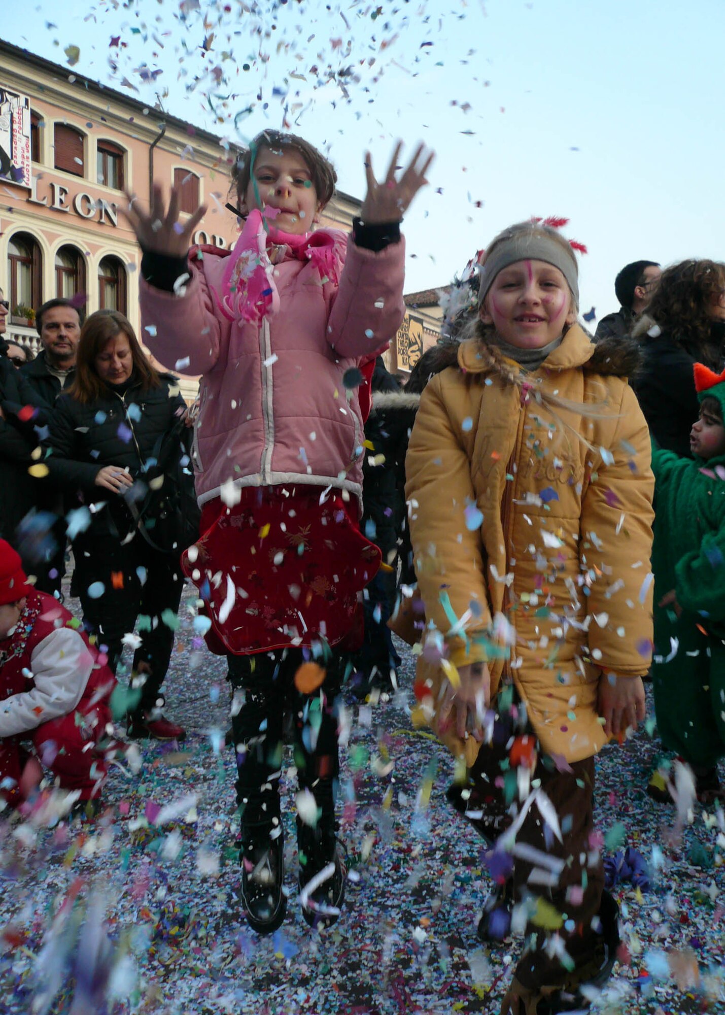 MANIAGO, Italy: An American and Italian girl take part in the festivities held during the "Canevale Dei Ragazzi: 45 Giri" held in Maniago Feb. 22.  Confetti lined the city streets along the parade route and town square where music, games, food and wine were available to event goers. Carnevale is held every year in February and lasts nearly two weeks.  A more well known festival is the "Carnevale di Venezia" where thousands of people cram themselves together in the famous St. Mark's Square in Venice.  (U.S. Air Force photo/Tech. Sgt. Michael O'Connor)