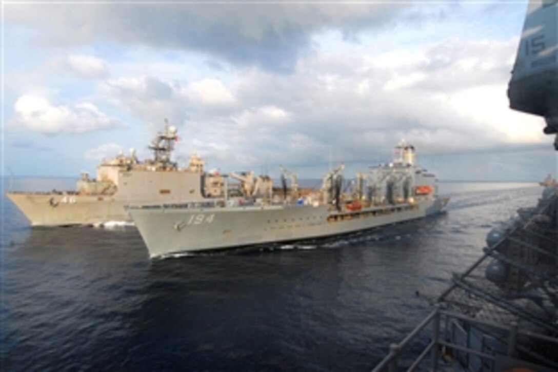 The fleet replenishment oiler USNS John Ericsson, right, and the amphibious dock landing ship USS Tortuga perform a breakaway maneuver after an underway replenishment with the forward-deployed amphibious assault ship USS Essex in the Gulf of Thailand, Feb. 24, 2009.