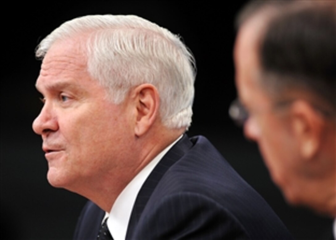 Defense Secretary Robert M. Gates gives his remarks with Navy Adm. Mike Mullen, chairman of the Joint Chiefs of Staff, during a press briefing at the Pentagon, Feb. 26, 2009.