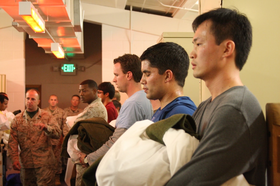 Students from the University of Southern California’s Marshall School of Business stand on line as Gunnery Sgt. Peter J. O’Brien, an instructor with the Combat Center’s Staff Noncommissioned Officer Academy’s Sergeants Course, informs them that speed, intensity and teamwork will be key to their success during a rack-making session similar to recruit training as part of the USC MBA Leadership Challenge hosted by Sergeants Course Feb. 27.
