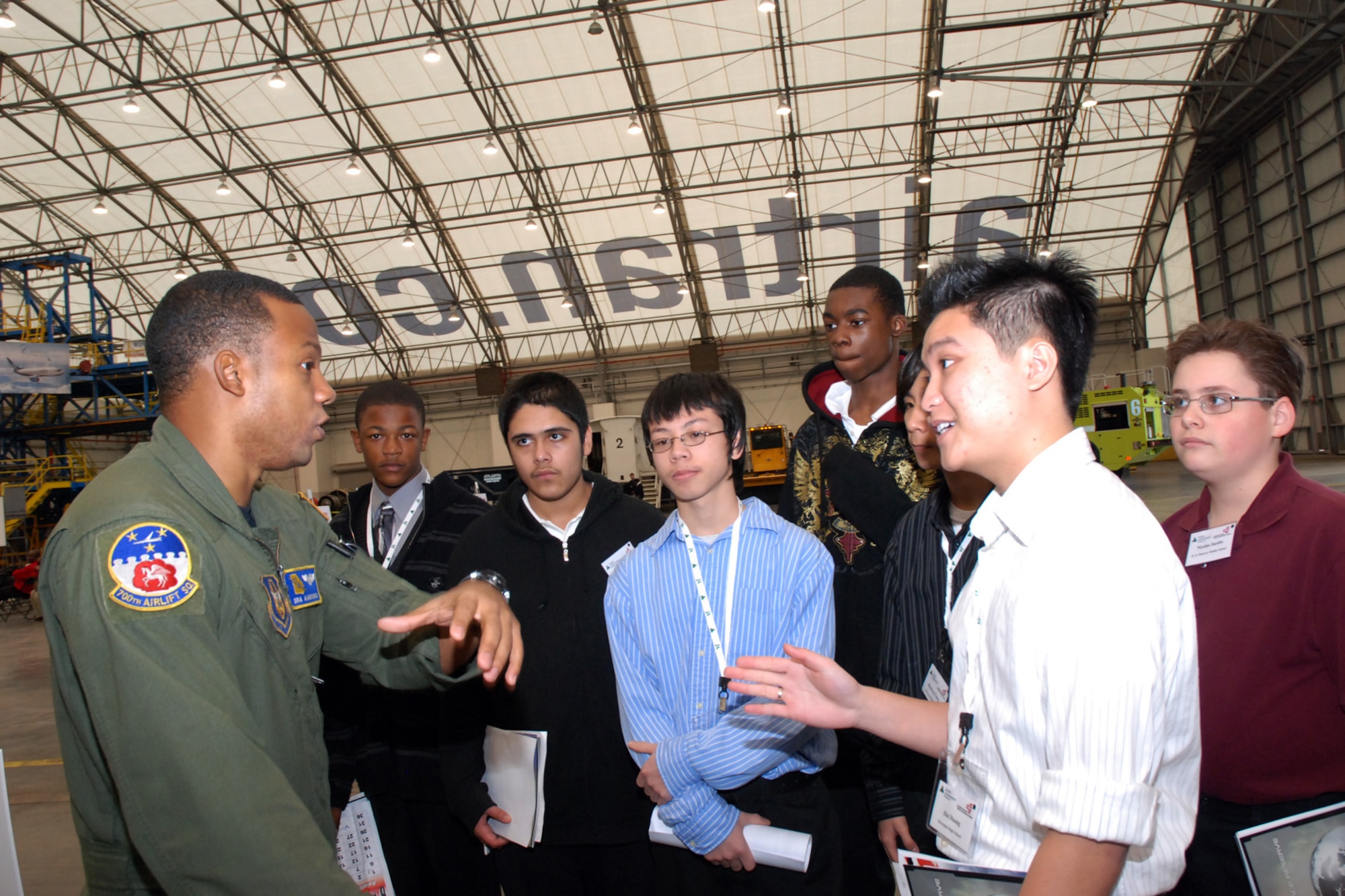 ATLANTA, Ga. -- Senior Airman Aaron Brown, 700th Airlift Squadron loadmaster, tell students how the U.S. Air Force Reserve has provided career opportunities for himself in addition to his college education.  More than 100 students conversed with Dobbins' pilots and loadmasters at the Hartsfield-Jackson Atlanta International Airport's "One Great Day of Job Shadowing" event Feb. 27.  The event was hosted by the airport for more than 300 metro Atlanta junior high and high school students interested in careers in aviation.  (U.S. Air Force photo/Master Sgt. Stan Coleman)  