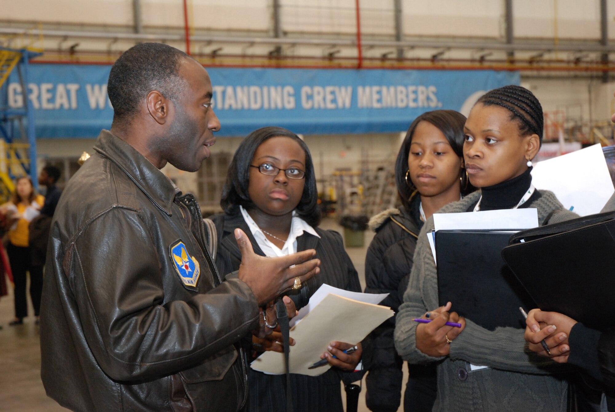 ATLANTA, Ga. - Lt. Col. Gil Williams, 94th Airlift Wing Command Post commander, provides insight to students on making a career decision in aviation at the Hartsfield-Jackson Atlanta International Airport's "One Great Day of Job Shadowing" event Feb. 27.  The event was hosted by the airport for more than 300 metro Atlanta junior high and high school students interested in careers in aviation.  Career representatives from the Atlanta area included pilots--Air Force Reserve and commercial; the Federal Aviation Administration, and airport representatives in mechanical engineering and airport concessions.  (U.S. Air Force photo/Master Sgt. Stan Coleman)  