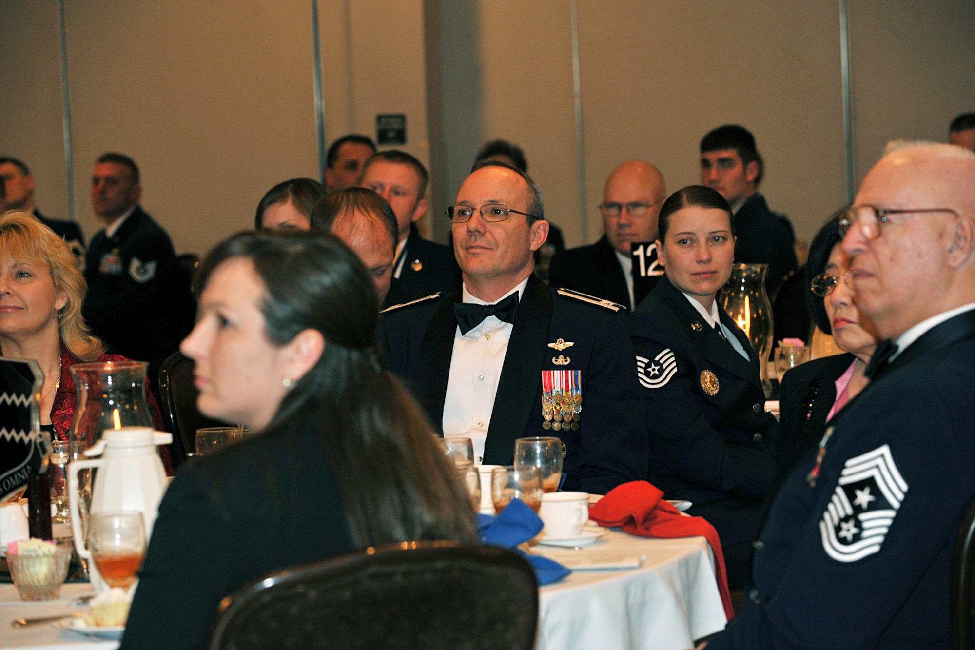 OFFUTT AIR FORCE BASE, Neb. -- Col. Robert Maness, 55th Wing vice commander, and others look on as Chief Master Sgt. Dean Howell, superintendent of the 55th Operations Group, speaks to graduates of the James M. McCoy Airman Leadership Class 09-C Feb. 12. Through four weeks of dedication and hard work, 37 graduates have enhanced their leadership skills to guide this next generation of airman coming into the Air Force.