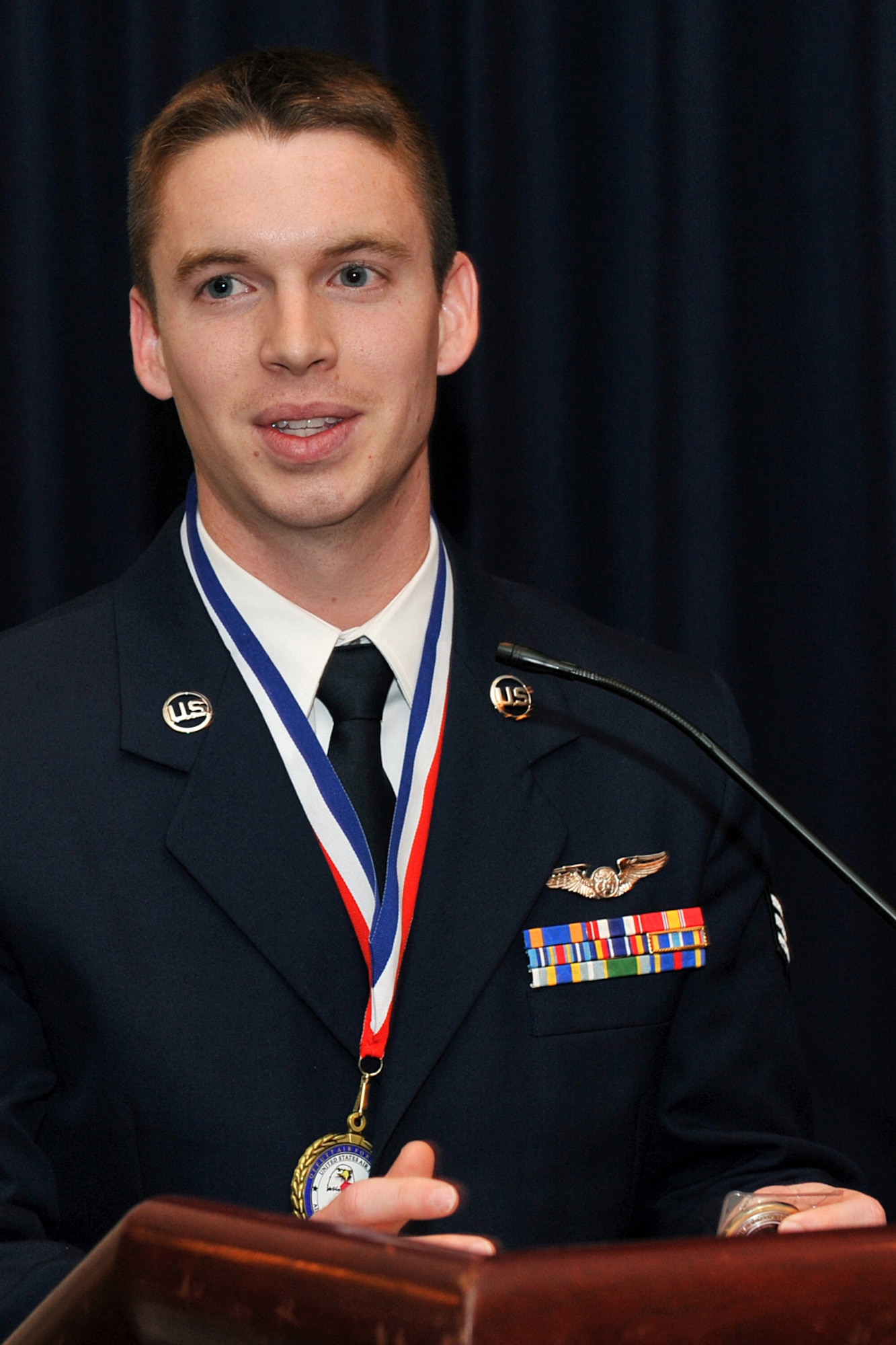 OFFUTT AIR FORCE BASE, Neb. -- Senior Airman Scott Williams,  97th Intelligence Squadron, addresses the crowd after winning the John L. Levitow award for the James M. McCoy Airman Leadership School Class 09-C Feb.12. After four weeks of dedication and hard work, 37 graduates lined up to receive their diplomas. 