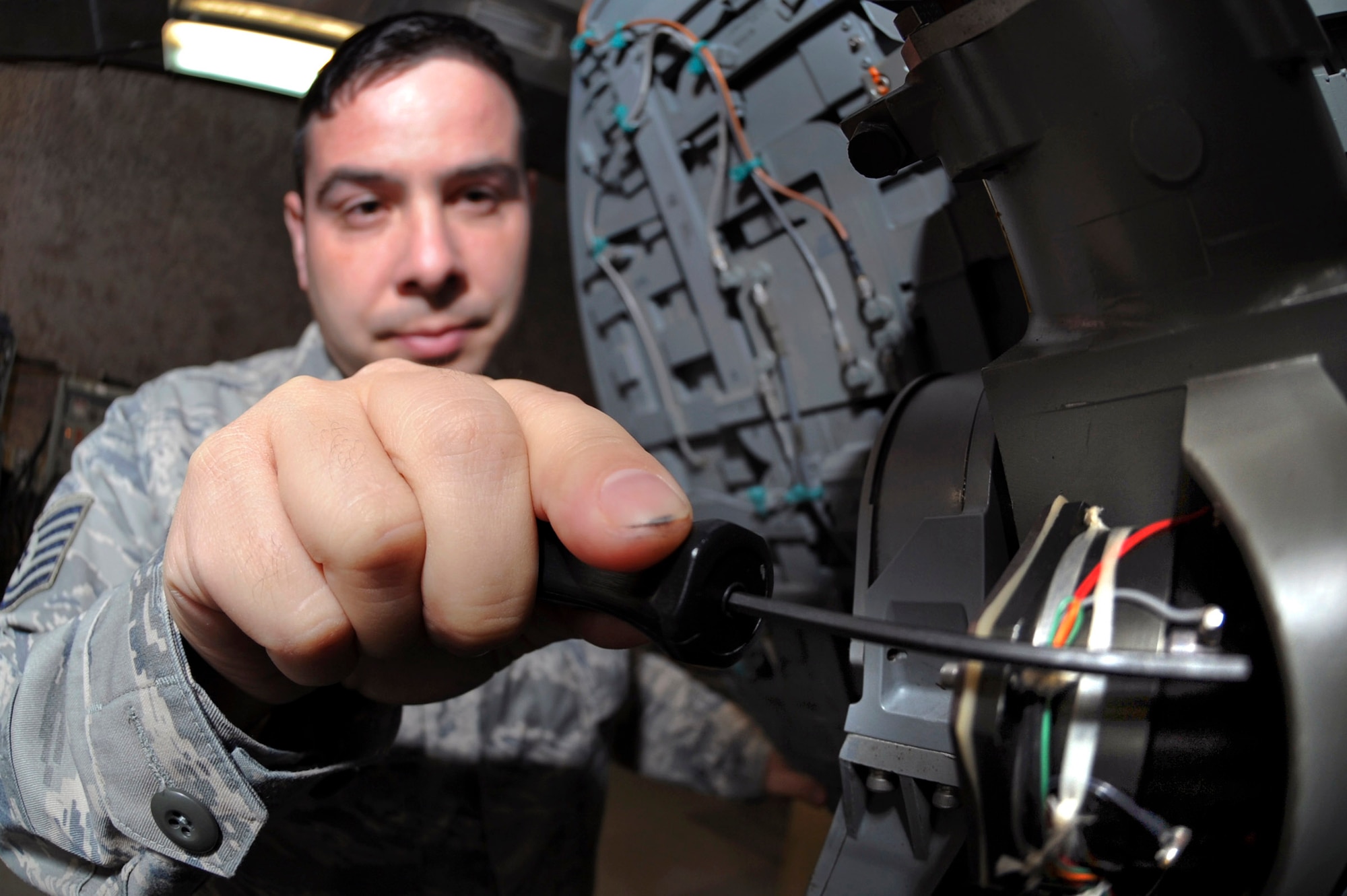 Tech. Sgt. Henry Diogo performs a quality assurance inspection on an F-15E Strike Eagle radar antenna Feb. 19 in an undisclosed location in Southwest Asia. The antenna directs the radar energy which allows the pilot of the aircraft to locate and lock onto targets. Sergeant Diogo is the F-15E Avionics Production Supervisor with the 379th Expeditionary Maintenance Squadron. (U.S. Air Force photo/Staff Sgt. Joshua Garcia)