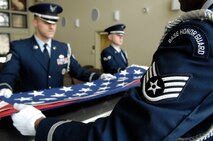 HANSCOM AIR FORCE BASE, Mass. – Patriot Honor Guard members fold an American flag during a training session Feb. 25. The base community is invited to attend the Patriot Honor Guard Appreciation Banquet at the Minuteman Club on March 13. Cocktails will be served at 6 p.m.; dinner will be served at 7 p.m. Cost is $28 for club members and $30 for nonmembers. Reservations must be made before March 6. For tickets or more information contact Staff Sgt. Danielle Flynn at (781) 377-4850 or e-mail Danielle.flynn@hanscom.af.mil or Staff Sgt. Jaclyn Chateau at (781) 377-4850 or e-mail Jaclyn.chateau@hanscom.af.mil.  (U.S. Air Force photo by Mark Wyatt) 