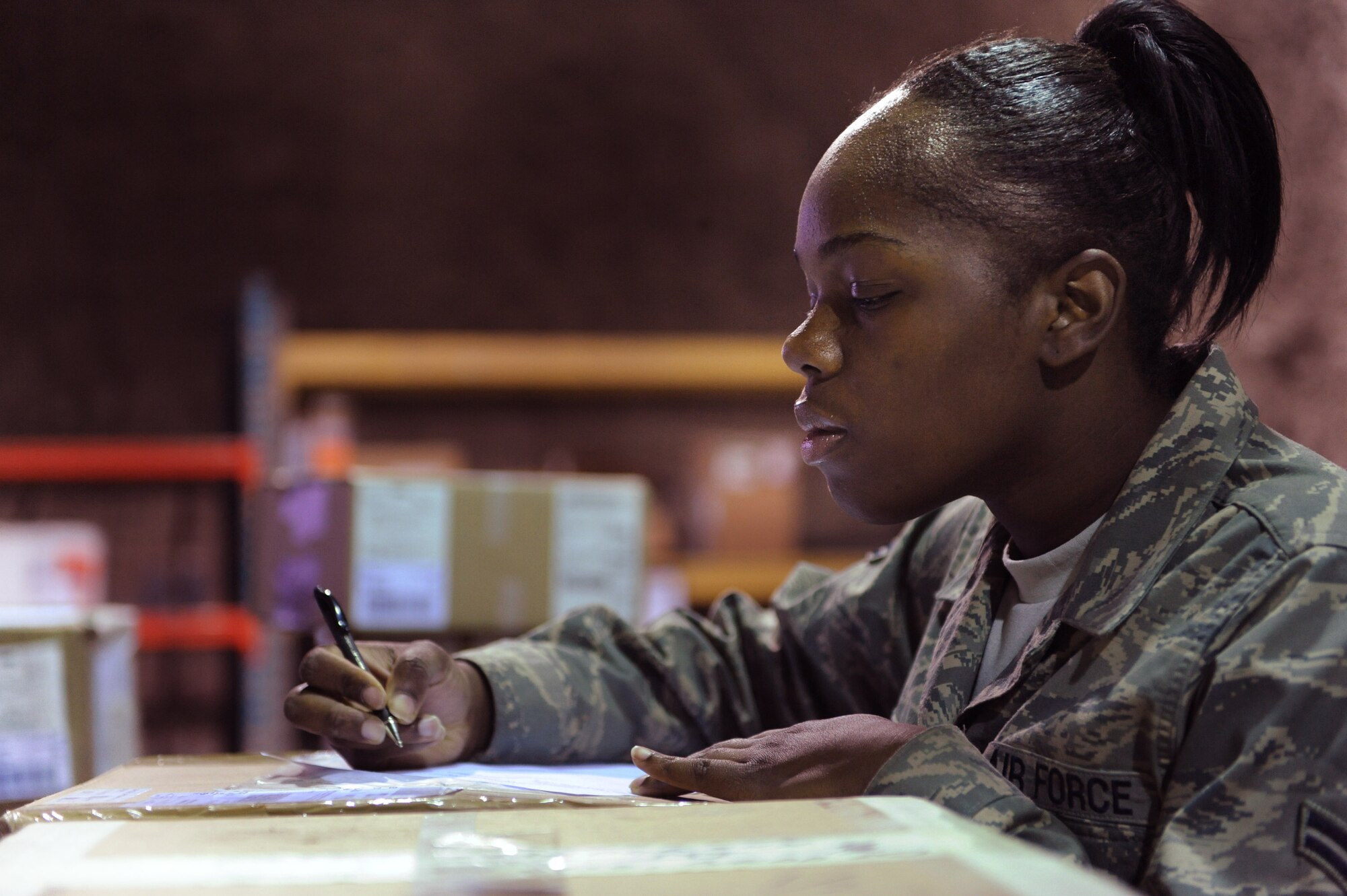 Airman 1st Class Jasmine Charles in-checks cargo Feb. 17 at Joint Base Balad, Iraq. The traffic management office is responsible for in-checking Air Force cargo from five parcel carriers. She is a 332nd Expeditionary Logistics Readiness Squadron traffic management apprentice deployed from Minot Air Force Base, S.D. Airman Charles is a native of Seattle. (U.S. Air Force photo/Senior Airman Elizabeth Rissmiller) 
