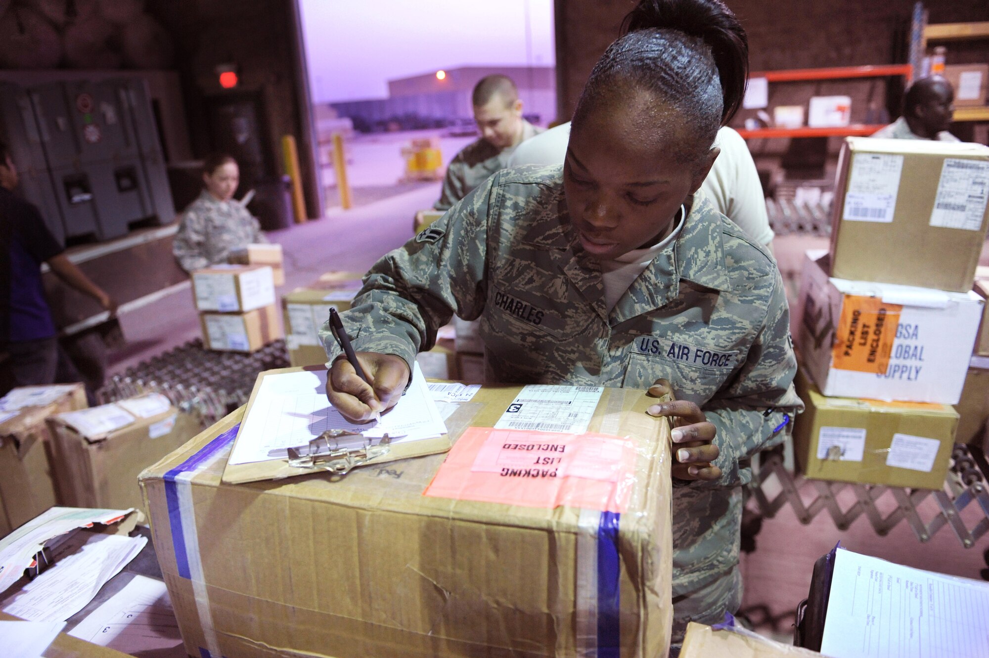 Airman 1st Class Jasmine Charles in-checks cargo Feb. 17 at Joint Base Balad, Iraq. The traffic management office is responsible for in-checking Air Force cargo from five parcel carriers. She is a 332nd Expeditionary Logistics Readiness Squadron traffic management apprentice deployed from Minot Air Force Base, S.D. Airman Charles is a native of Seattle. (U.S. Air Force photo/Senior Airman Elizabeth Rissmiller) 
