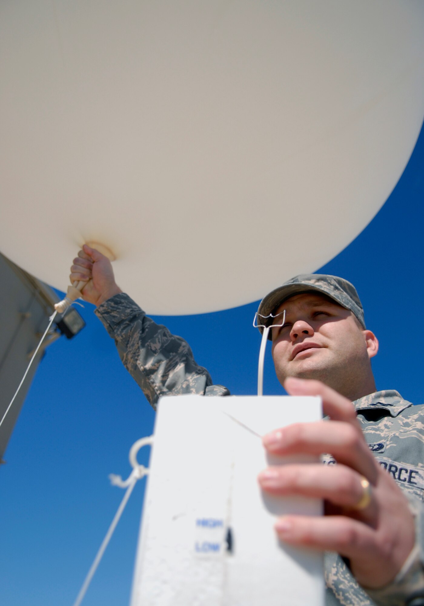 VANDENBERG AIR FORCE BASE, Calif. -- Capt. Andrew Frey, 30th Weather Squadron officer, prepares to release a weather balloon here Feb. 25. The weather balloons can reach heights of 110,000 ft. and attains weather information every 100 ft. (U.S. Air Force photo / Senior Airman Christopher Hubenthal)