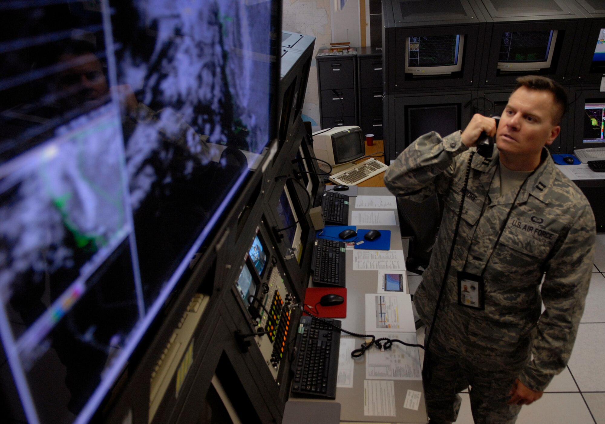 VANDENBERG AIR FORCE BASE, Calif. -- Capt. Howard Moore, 30th Weather Squadron officer, studies a screen of weather information here Feb. 25. (U.S. Air Force photo / Senior Airman Christopher Hubenthal)