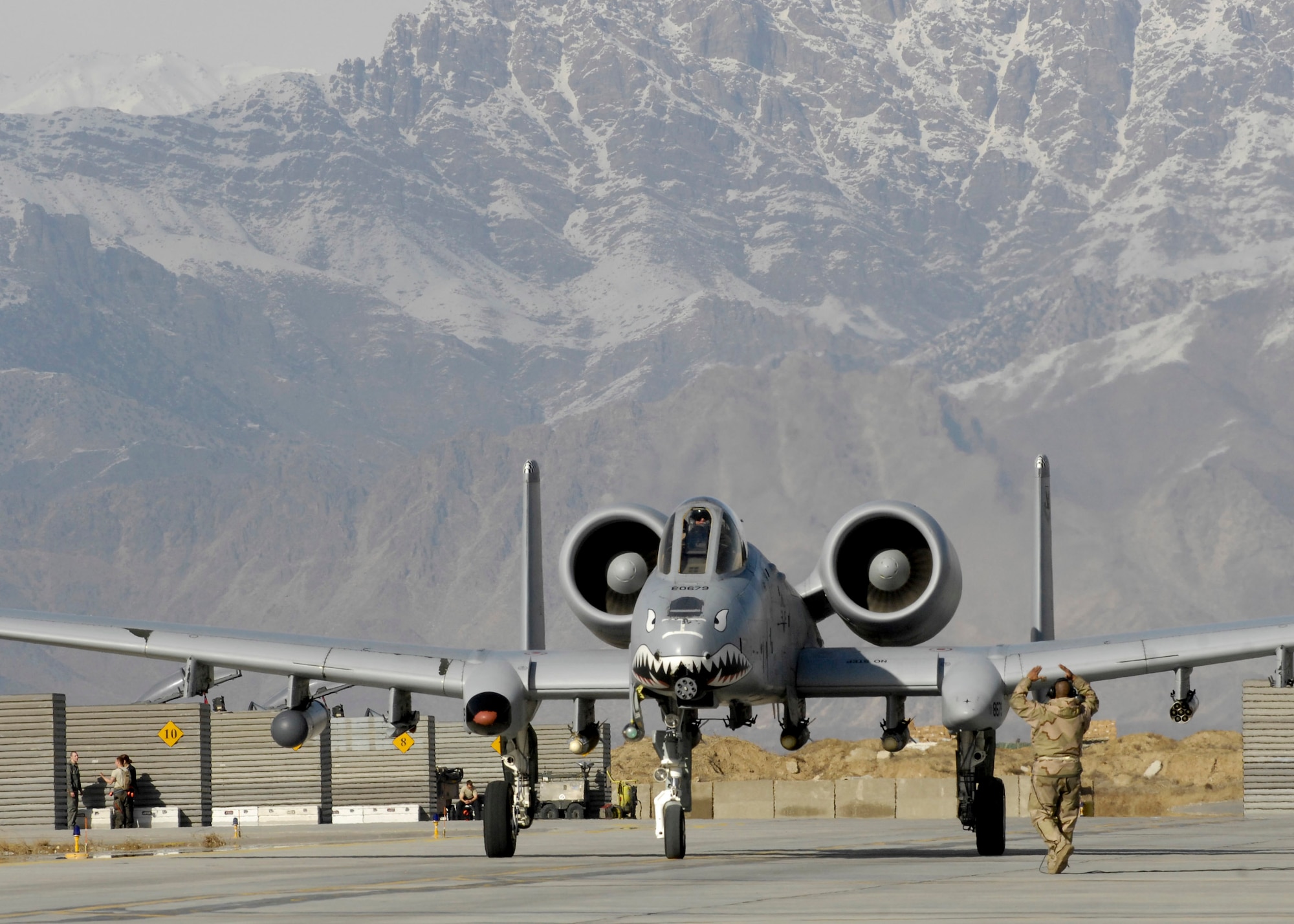 Lt. Col. Sam Milam taxies down the flightline in an A-10 Thunderbolt II after logging the unit's 10,000th combat flight hour during a mission Feb. 24 at Bagram Airfield, Afghanistan. Members of the 75th EFS arrived here in September for a four-month deployment, but was extended to six months. Colonel Milam is the 75th Expeditionary Fighter Squadron commander. (U.S. Air Force photo/Staff Sgt. Jason Lake)
