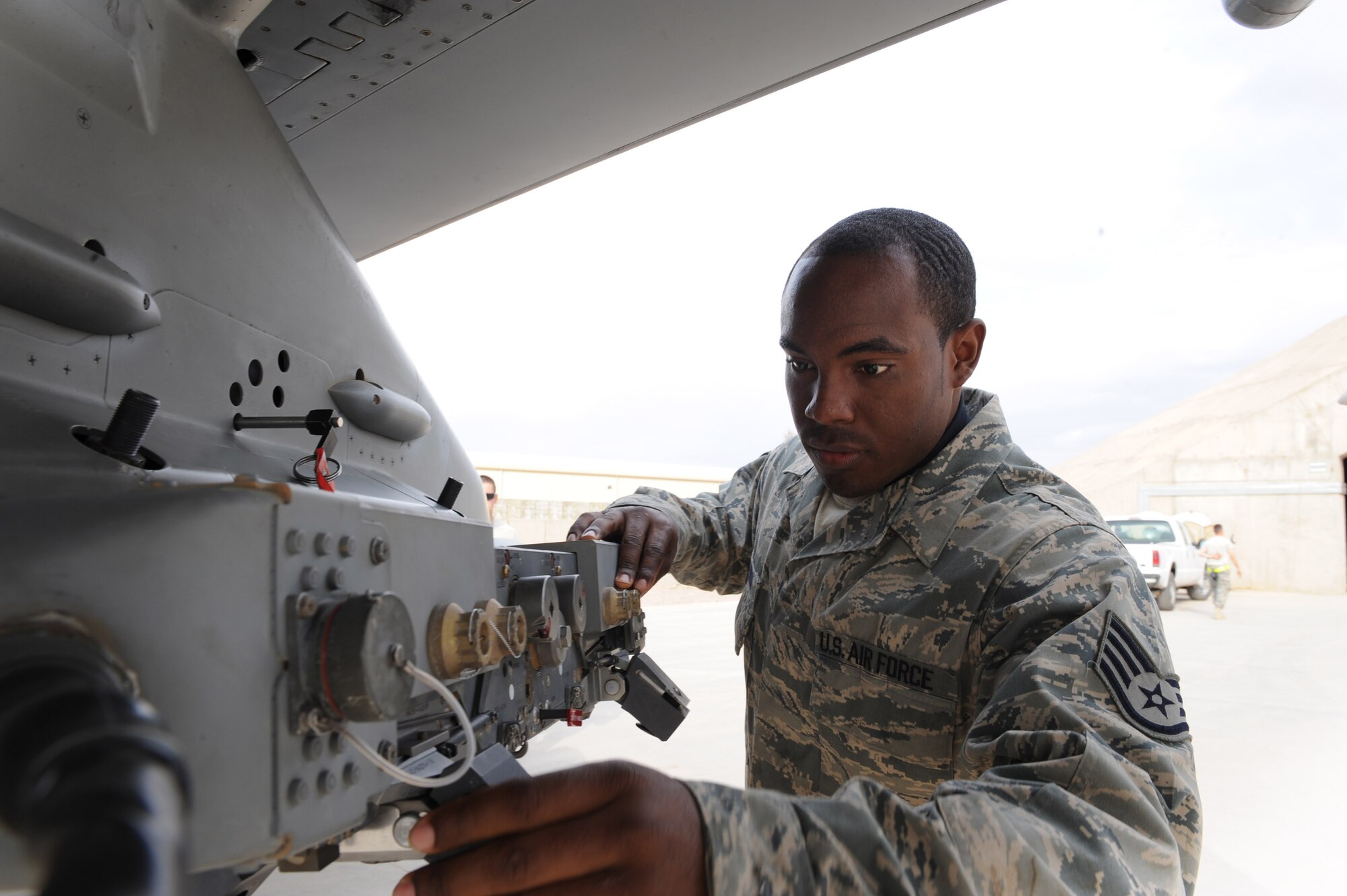 Staff Sgt. Joe Nathan Jr. inspects an F-16 Fighting Falcon after its return from a mission Feb. 23 at Joint Base Balad, Iraq. As an F-16 weapons loader, Sergeant Nathan is responsible for loading missiles onto the F-16 as well as performing post-load inspections on the weapons. Sergeant Nathan is a 332nd Expeditionary Aircraft Maintenance Squadron Tiger Aircraft Maintenance Unit weapons loader deployed from Homestead Air Reserve Base, Fla. He is a native of Macon, Ga. (U.S. Air Force photo/Senior Airman Tiffany Trojca) 
