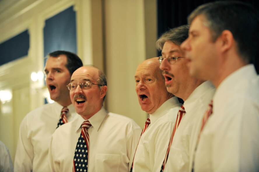 OFFUTT AIR FORCE BASE, Neb.,-- U. S. Strategic Command?s Command Performers sing God Bless America during the National Prayer Luncheon at the Patriot Club Feb. 24. Throughout this luncheon, many of Offutt?s personnel representing different faiths and backgrounds came together to pray for warriors fighting for our nation and our families. 