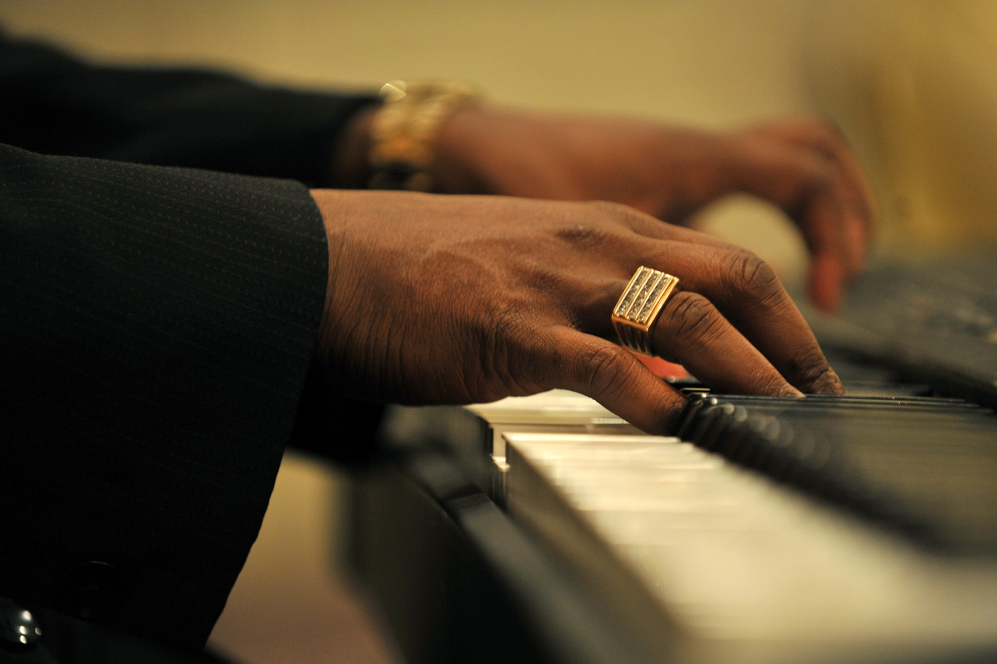OFFUTT AIR FORCE BASE, Neb., -- Rev. Frederick McCullough, pastor of St. John Christian Methodist Episcopal church, plays the piano and sings a song of inspiration during the National Prayer Luncheon held at the Patriot Club Feb. 24. Throughout this luncheon, many of Offutt?s personnel representing different faiths and backgrounds came together to pray for warriors fighting for our nation and our families. 