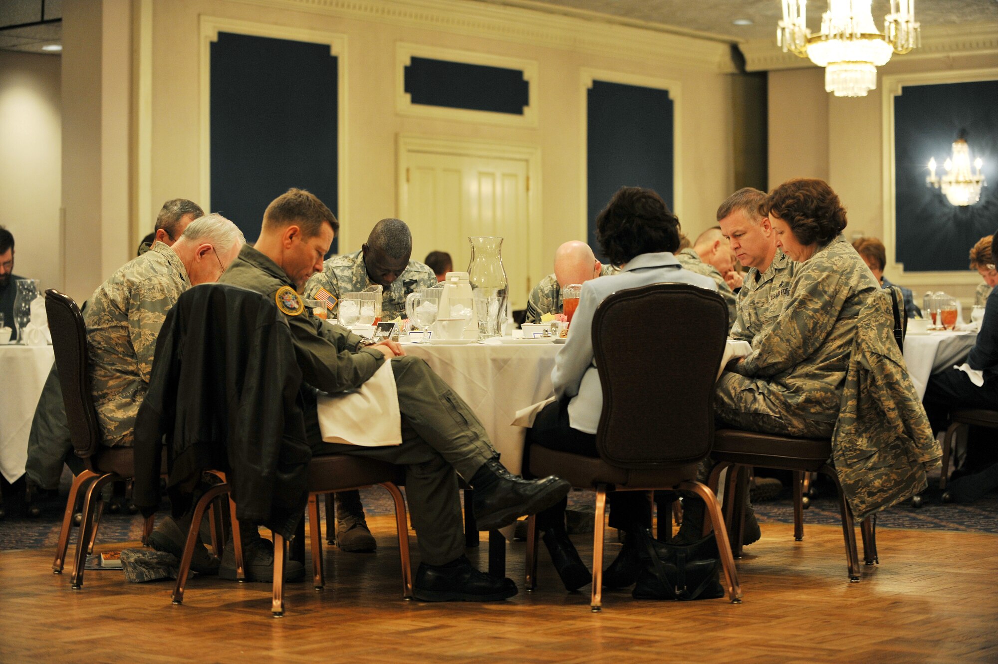 OFFUTT AIR FORCE BASE, Neb., -- Col. Robert Maness, 55th Wing vice commander, and other team Offutt members came together to offer up prayers for deployed troops and their families during the National Prayer Luncheon at the Patriot Club Feb. 24. Throughout this luncheon, many of Offutt?s personnel representing different faiths and backgrounds came together to pray for warriors fighting for our nation and our families. 