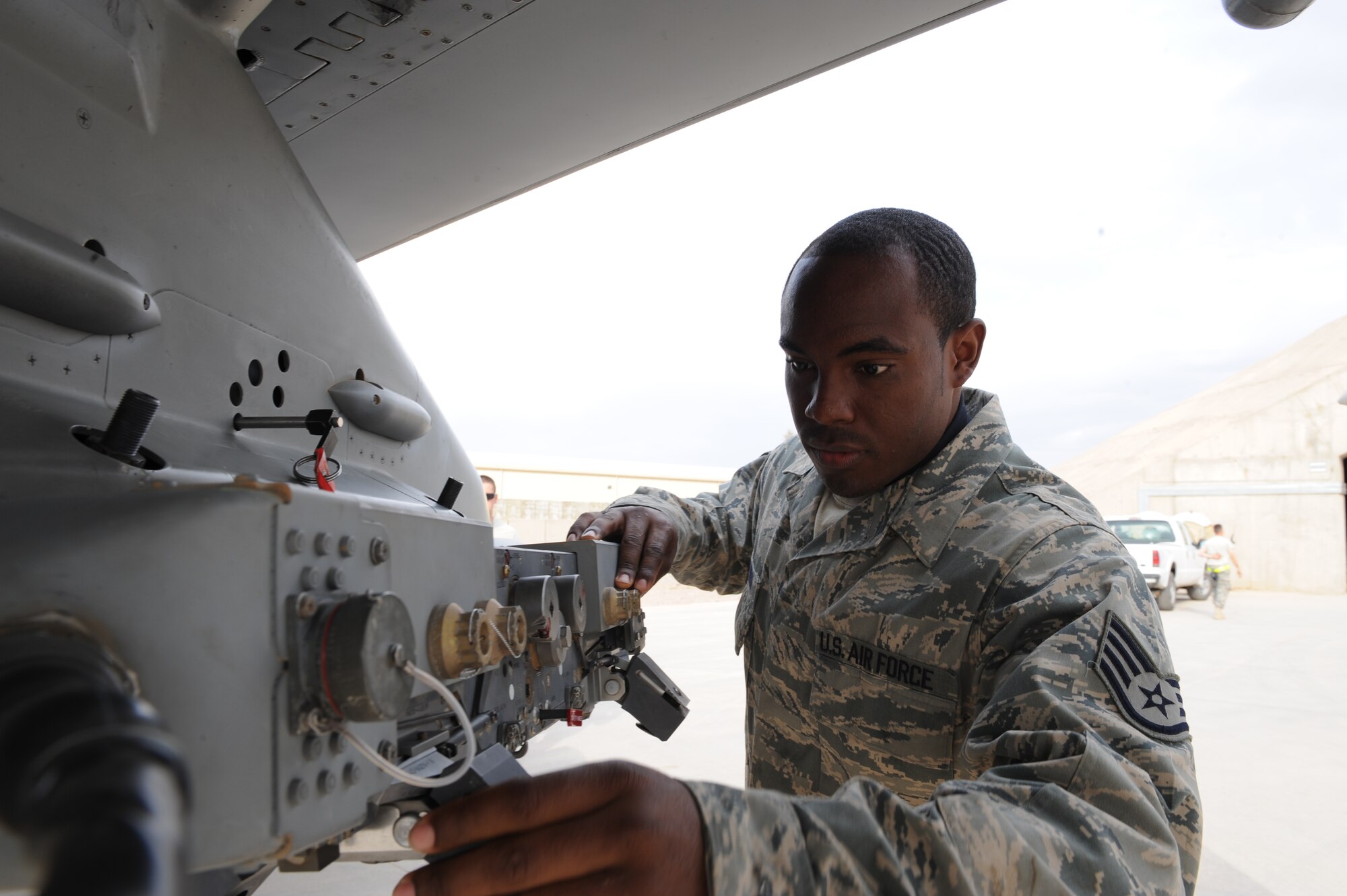 JOINT BASE BALAD, Iraq -- Staff Sgt. Joe Nathan Jr., 332nd Expeditionary Aircraft Maintenance Squadron Tiger Aircraft Maintenance Unit weapons loader, inspects an F-16 Fighting Falcon after its return from a mission, Feb. 23. As an F-16 weapons loader, Nathan is responsible for loading missiles onto the F-16 Fighting
Falcon, as well as performing post-load inspections on the weapons. Nathan is deployed here from the 482nd Aircraft Maintenance Squadron at Homestead Air Reserve Base, Fla., and is a native of Macon, Ga. (U.S. Air Force photo/Senior Airman Tiffany Trojca)

