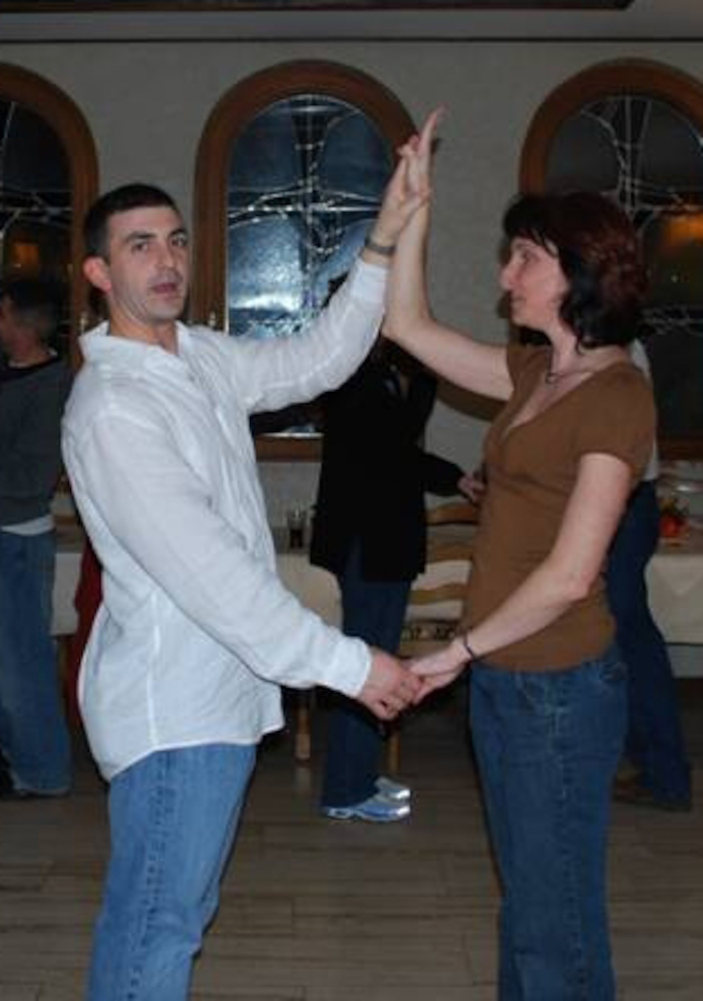 MARING, Germany –Angie and Staff Sgt. Chris Johnson, 52nd Communications Squadron, give a salsa dance lesson during the fall 2008 Mosel Reintegration Retreat. The Airman & Family Readiness Center is offering another reintegration retreat March 27-29 to help couples learn skills to enhance their relationships after a period apart or to help them prepare for a pending deployment or remote assignment. (Courtesy photo)