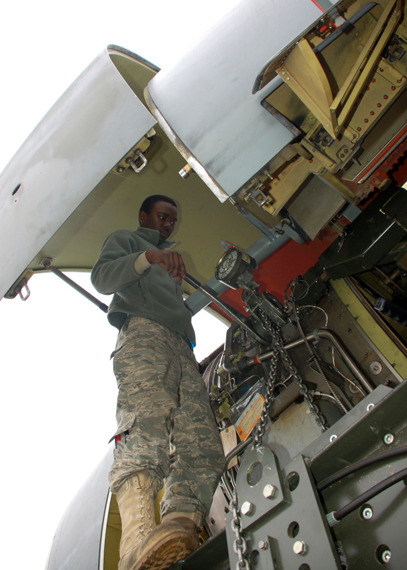 Airman 1st Class Demitrius Stockard torques a bolt while helping to install a turbofan engine on a KC-135 Stratotanker at Manas Air Base, Kyrgyzstan. Airman Stockard is a jet engine mechanic assigned to the 376th Expeditionary Aircraft Maintenance Squadron and is deployed from the 92nd AMXS at Fairchild Air Force Base, Wash. (U.S. Air Force photo/Maj. Damien Pickart)