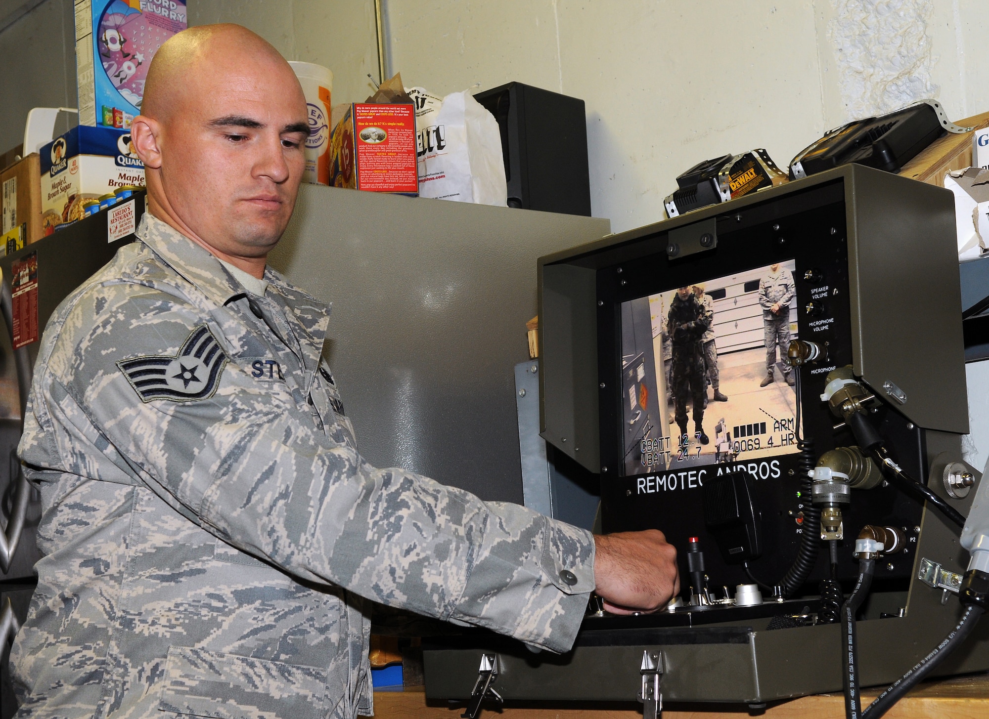 Operating a Remotec F-6A Andros Hazardous Duty Robot, Staff Sgt. Nicholas Stehling shows off a recently acquired piece of equipment designed to assist explosive ordnance disposal personnel get the job done safely. (U.S. Air Force photo by Master Sgt. Paul Gorman)