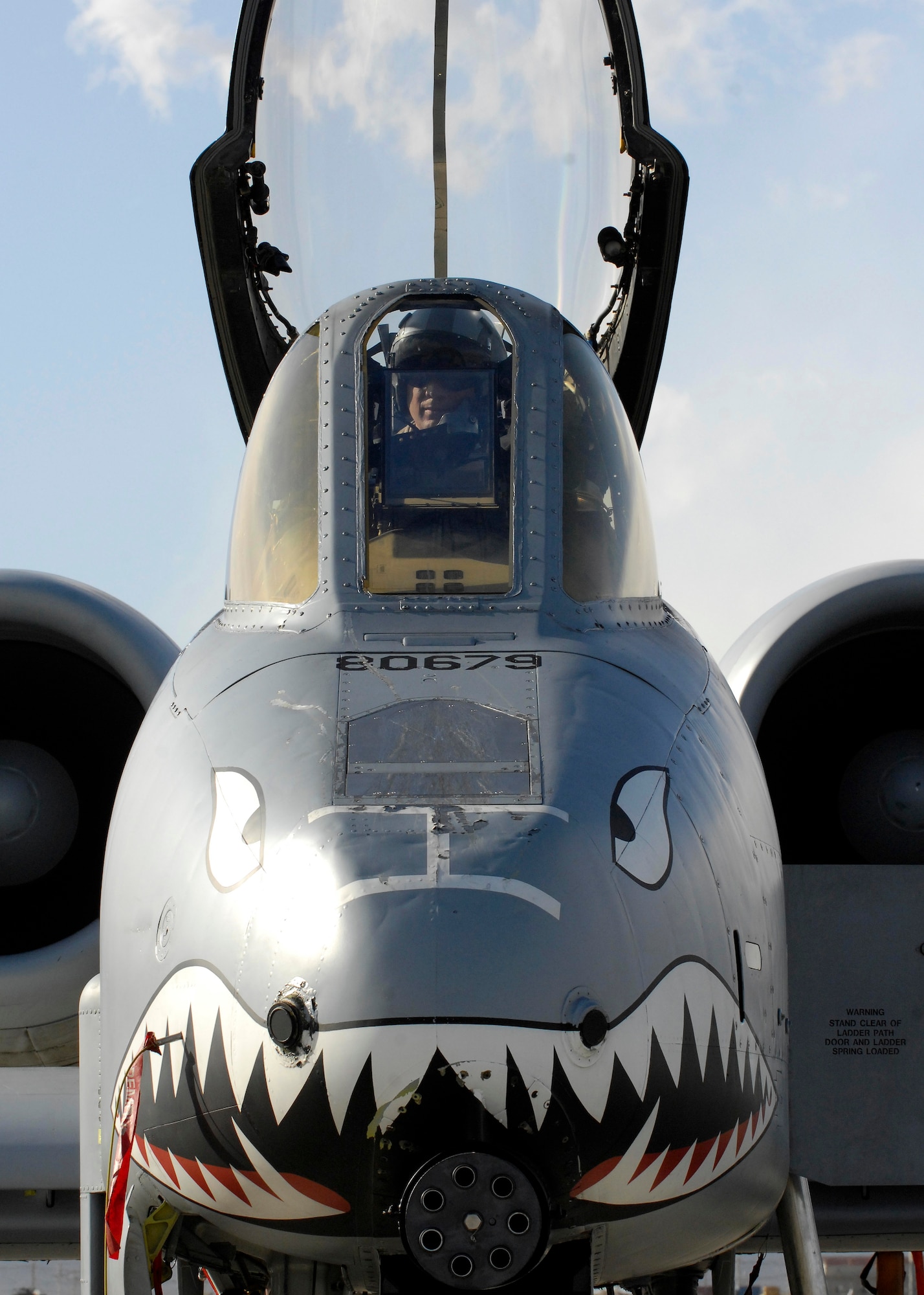 Lt. Col. Sam Milam, 75th Expeditionary Fighter Squadron commander, prepares to dismount his A-10C Thunderbolt II after competing a mission that broke the unit's 10,000th combat flight hour mark here during a single deployment rotation. This was the first time a squadron deployed here reached 10,000 combat hours. The 75th EFS arrived here in September for a four-month deployment, but was extended to six months. The A-10 Thunderbolt II was the first tactical fighter aircraft to deploy here in 2002.