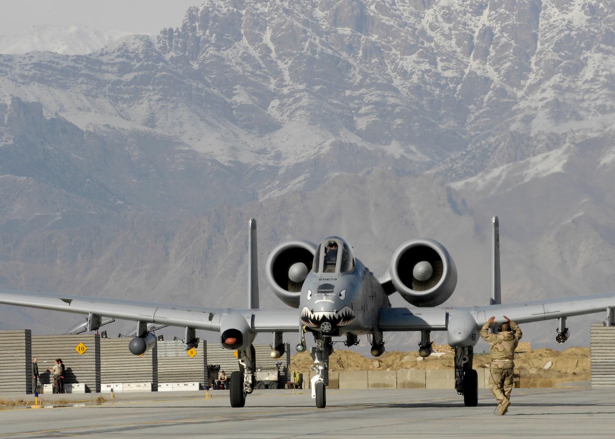 Lt. Col. Sam Milam, 75th Expeditionary Fighter Squadron commander, taxis down Bagram Air Field after logging the unit's 10,000th combat flight hour during a mission Feb. 24. This was the first time a squadron deployed here reached 10,000 combat hours. The 75th EFS arrived here in September for a four-month deployment, but was extended to six months. The A-10 Thunderbolt II was the first tactical fighter aircraft to deploy here in 2002.