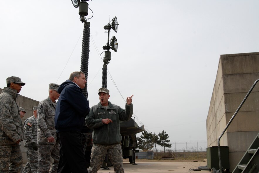 Army Chief Warrant Officer 2 Bill McPherson, Alpha Company, 4th Battalion, 5th Regiment Air Defense Artillery, explains the Patriot Batteries' mission here at Kunsan to former Chief Master Sergeant of the Air Force Eric W. Benken, Feb 27 2009. Chief Benken was invited to tour Korea by Chief Master Sergeant Harry Viel, 7th Air Force command chief master sergeant. (U.S. Air Force Photo by SSgt Jason Colbert)