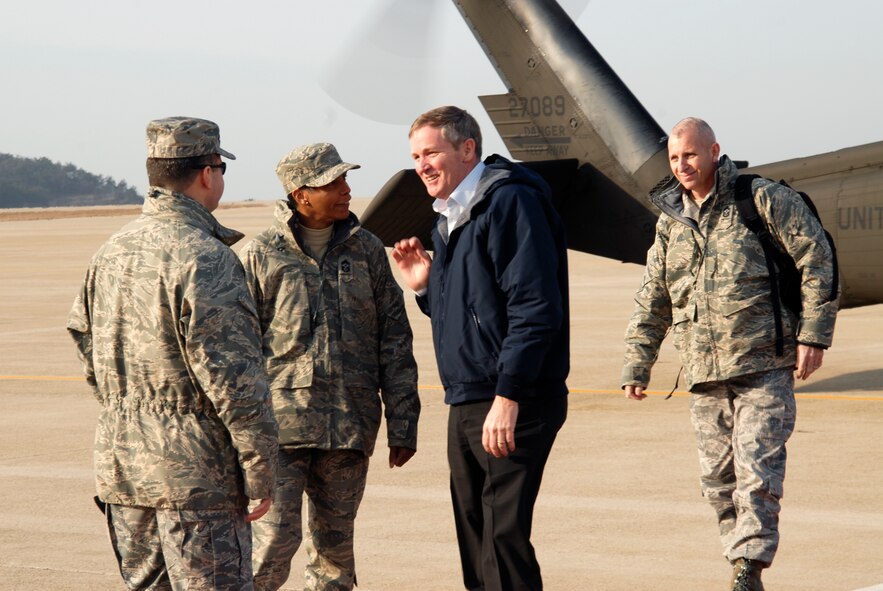 Master Sgt. Mike Jones, 8th Force Support Squadron first sergeant and Chief Master Sgt. Cathy Johnson, 8th Fighter Wing command chief master sergeant, greet former Chief Master Sergeant of the Air Force Eric W. Benken as he arrives at Kunsan Air Base, Republic of Korea, Feb 27 2009. Chief Benken is familiar with operations on the peninsula having been assigned to Osan Air Base from 1978 to 1979. (U.S. Air Force Photo by SSgt Jason Colbert)