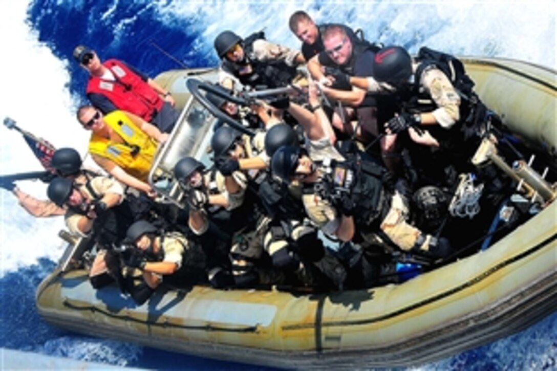 Members of a U.S. Navy visit, board, search and seizure team from the guided-missile cruiser USS Lake Champlain pull alongside the guided-missile destroyer USS The Sullivans during a training exercise in the Pacific Ocean, Feb. 13, 2009. The USS Lake Champlain and Sullivans are on a scheduled deployment in the western Pacific Ocean supporting global maritime security.