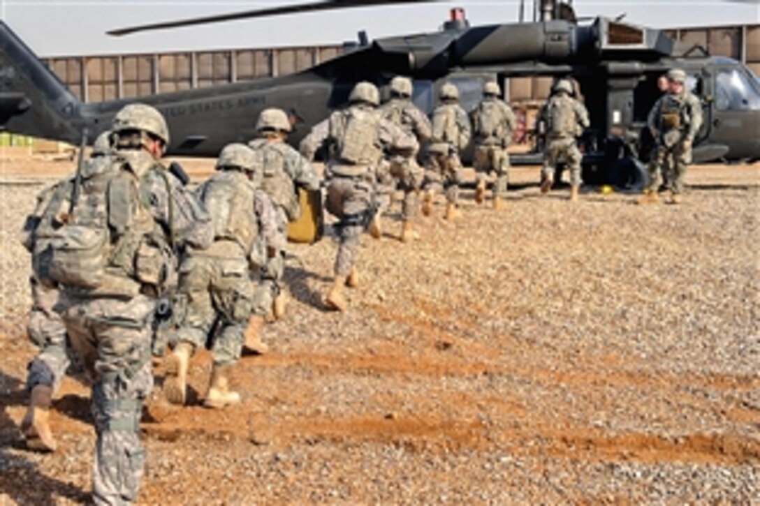 U.S. Army soldiers run toward a UH-60 Black Hawk helicopter during an Aerial Response Force training exercise on Forward Operating Base Loyalty in eastern Baghdad, Iraq, Feb. 25, 2009. The paratroopers are assigned to the 82nd Airborne Division's 73rd Cavalry Regiment, 3rd Brigade Combat Team.