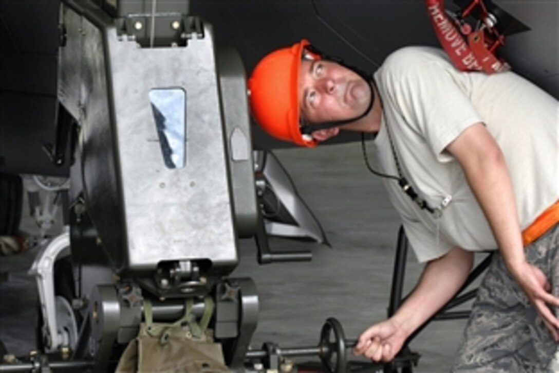 U.S. Air Force Staff Sgt. Terry Vickery operates an east-west hoist during installation of an F-22 canopy on Andersen Air Force Base, Guam, Feb. 18, 2009. Vickery is an egress technician assigned to 36th Expeditionary Maintenance Squadron.