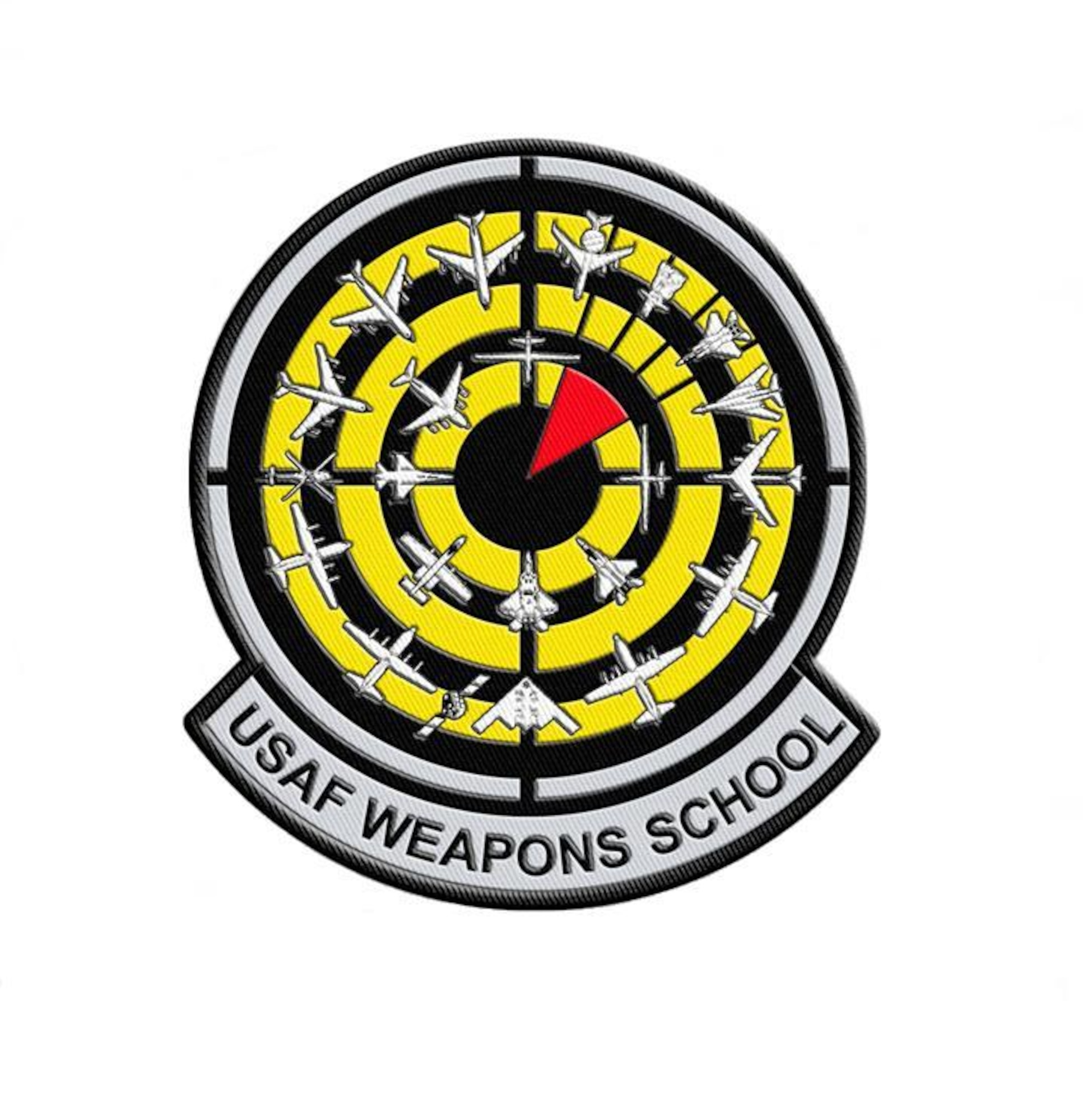 The new Weapons School’s patchdesign , adopted April 2008, reflects the expansion of the school, with 22 aircraft and weapons systems encircling a red “bomb on target” over a black and yellow bullseye background.  