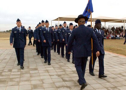 The first flight formation of Airmen preparing to graduate from basic military training march over the Enlisted Heroes Walk during the Jan. 2 ceremony at Lackland Air Force Base, Texas. (U.S. Air Force Photo/Alan Boedeker)