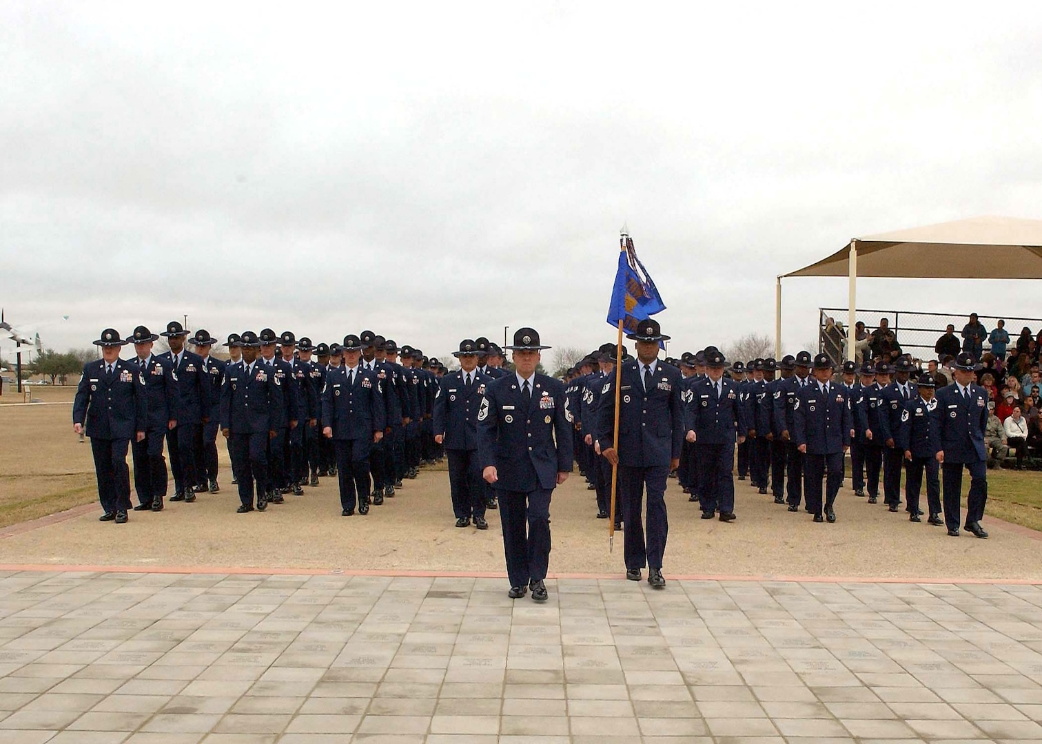 A formation of military training instructors marches over the Enlisted Heroes Walk during the Jan. 2 basic military training graduation ceremony at Lackland Air Force Base, Texas. (U.S. Air Force Photo/Alan Boedeker)