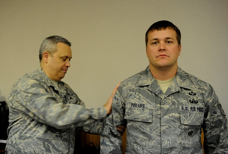 MOODY AIR FORCE BASE, Ga. – Staff Sgt. Jeremy Phillips, 820th Security Forces Group explosive ordnance technician, is promoted to technical sergeant by Brig. Gen. Michael Longoria, 93rd Air Ground Operations Wing commander, under the Stripes for Exceptional Performers program here Dec. 31. (U.S. Air Force photo by Senior Airman Gina Chiaverotti)