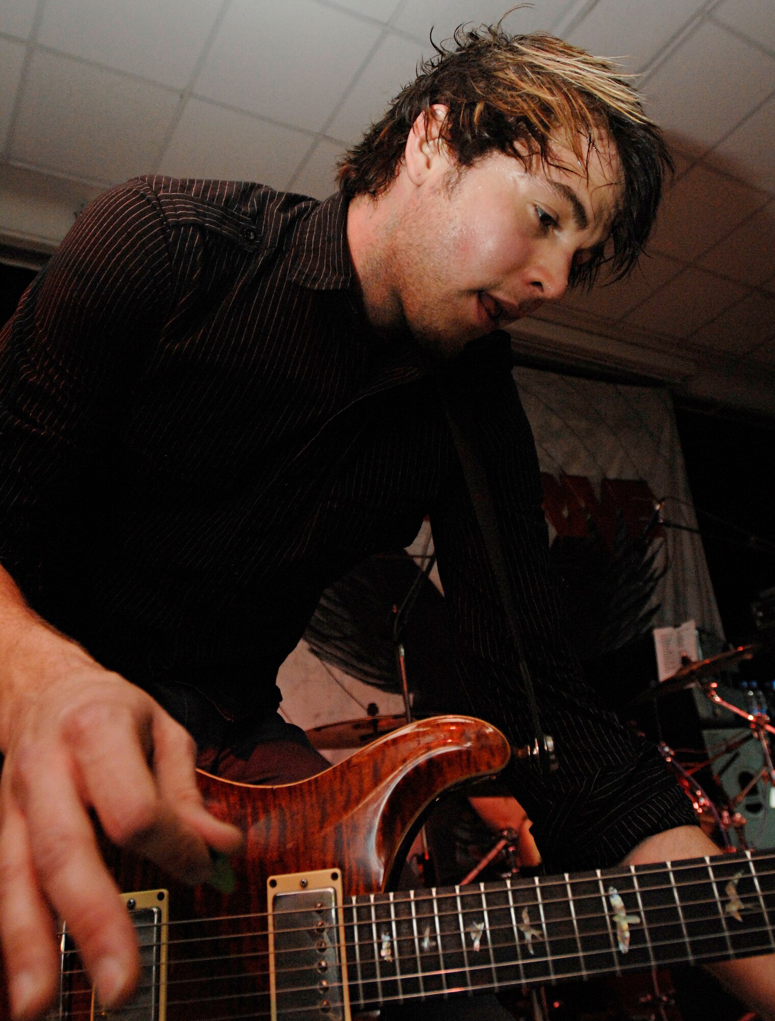 Justin Bonhiver, lead guitarist for Quietdrive, rocks out during the 2009 New Year’s Eve Bash hosted by the Incirlik Consolidated Club, Dec. 31. Quietdrive visited Incirlik as part of their Armed Forces Tour. (U.S. Air Force photo/Senior Airman Benjamin Wilson)
