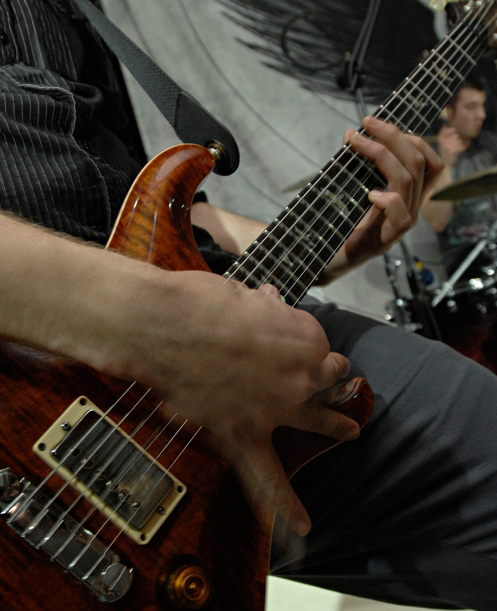 Justin Bonhiver, lead guitarist for Quietdrive, plays a face-melting solo during the 2009 New Year’s Eve Bash hosted by the Incirlik Consolidated Club, Dec. 31. Quietdrive visited Incirlik as part of their Armed Forces Tour. (U.S. Air Force photo/Senior Airman Benjamin Wilson)