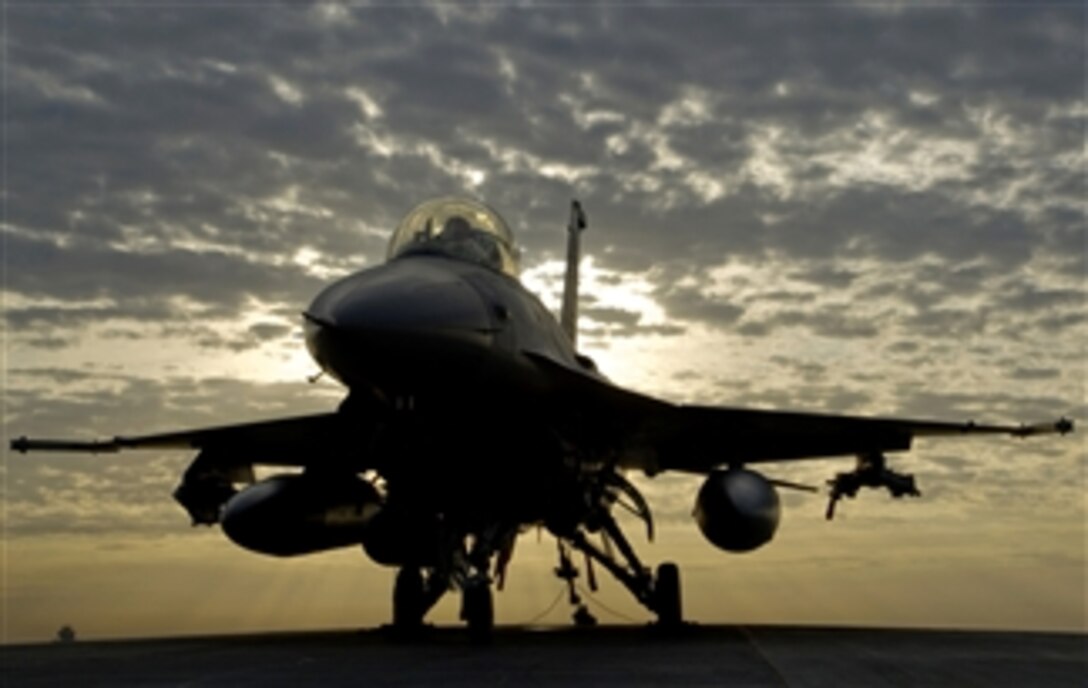 An F-16C Fighting Falcon sits tethered to the hot cargo pad at Joint Base Balad, Iraq, on the morning of Dec. 31, 2008.  The aircraft is tethered to secure it in place before a full afterburner engine run-up.  