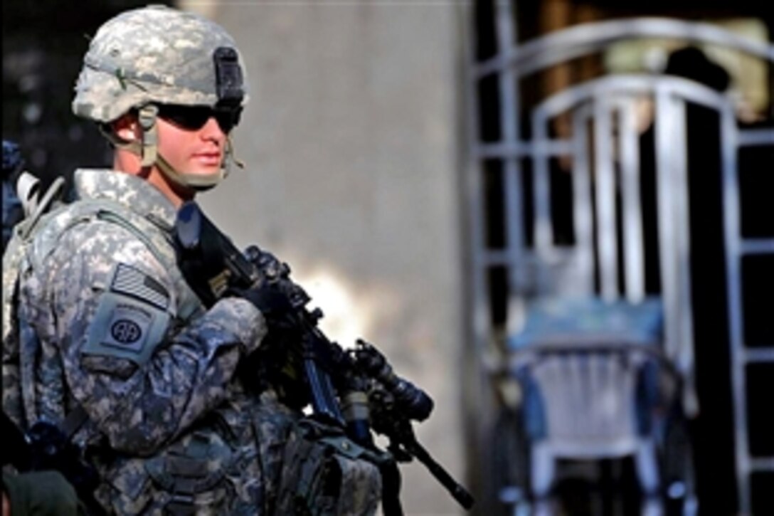 U.S. Army Sgt. Brian Ansley provides security during a medical mission in Baghdad, Iraq, Dec. 20, 2008. Ansley and fellow soldiers are assigned to the 82nd Airborne Division's 1st Battalion,  319th Field Artillery Regiment. During the mission, Iraqi doctors provide free medical care to local Iraqi residents.