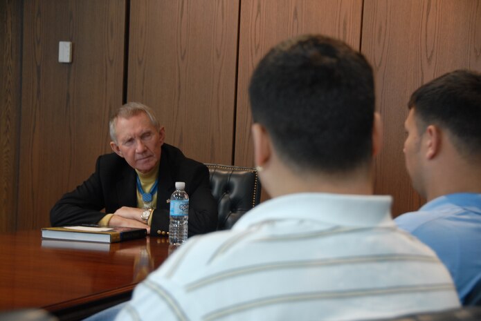 Retired Marine Maj. Gen. James Livingston speaks with family members and members of the Air Force Office of Special Investigations, Detachment 3 at Charleston AFB Dec. 30.  General Livingston recounted the events during his second tour of duty in Vietnam leading up to him receiving the Medal of Honor in 1970.  He also spoke about qualities of leadership. (U.S. Air Force photo/Staff Sgt. Jennifer Arredondo)